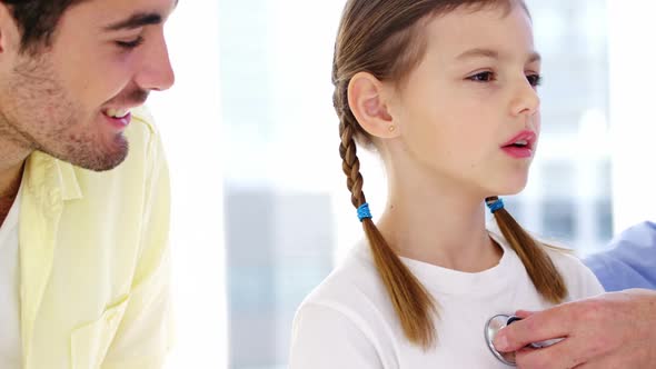 Male doctor examining a patient