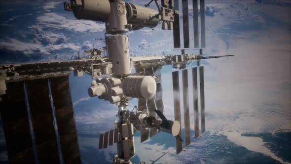 International Space Station in Outer Space Over the Planet Earth alt