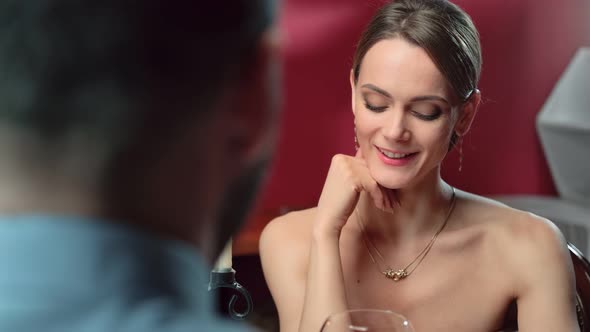 Woman Looking on Man Feeling Love at Romantic Meeting in Restaurant