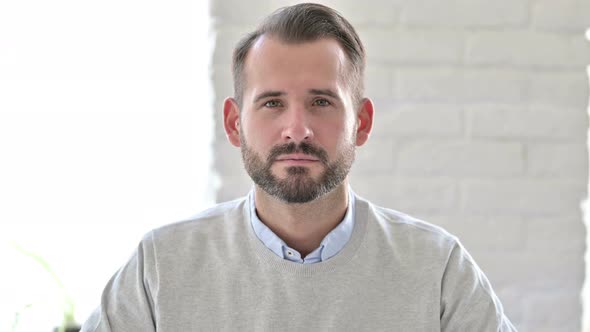 Portrait of Attractive Young Architect Looking at Camera 