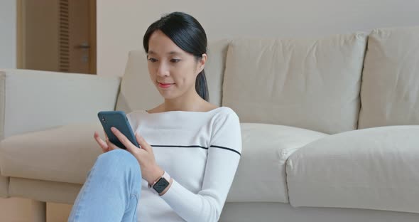 Woman use cellphone at home