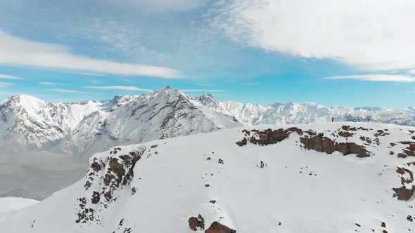 Skier Walks on the Summit