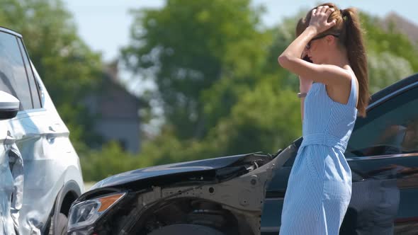 Sad Female Driver Speaking on Sellphone on Street Side Calling for Emergency Service After Car