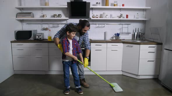 Son Helping Single Father with Domestic Chores