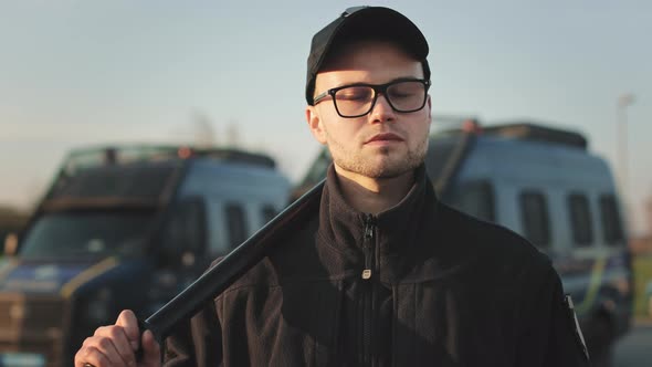 A Man in a Police Uniform is Going and Looking Around