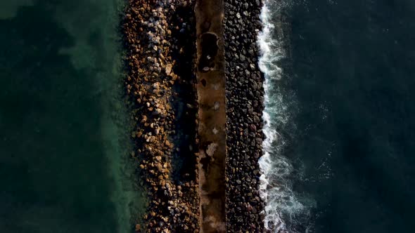 Top Down View on Breakwater a Far From the Beach