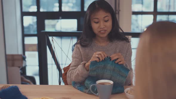 Knitting girls indoors