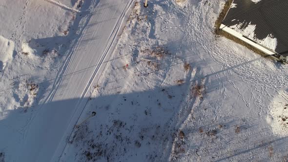 Top down aerial view of Winter snowy road in the village. 13 alt