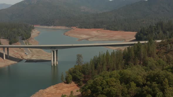 Aerial view of Highway bridge over Shasta Lake in Northern California low water levels during drough