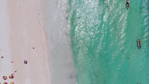 Aerial Top Paradise Beach with Umbrellas and Turquoise Ocean Nungwi Zanzibar