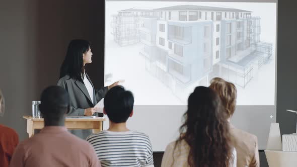 Asian Woman Presenting Architectural Project on Conference