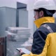 Follow footage of employees male warehouse worker engineer in hard hat working - VideoHive Item for Sale