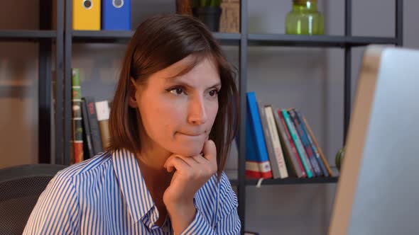 Business woman browsing computer screen