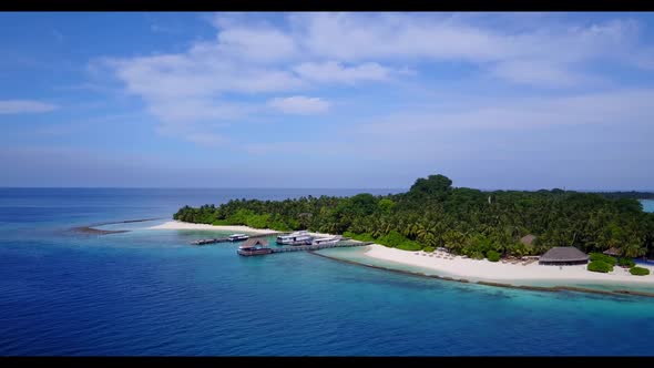 Aerial travel of tranquil lagoon beach trip by blue green sea and white sand background of journey n