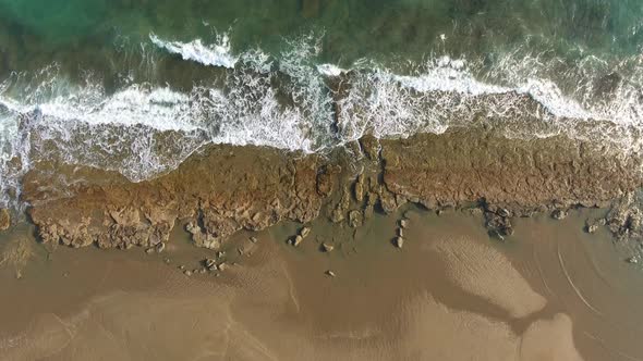 Shallow Rocky Reef Between the Sea and the Beach