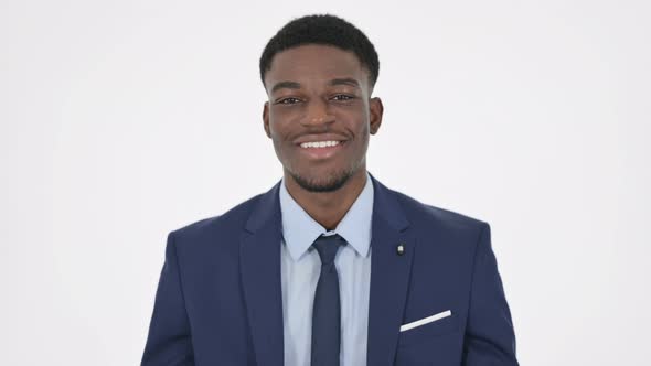 African Businessman Smiling at Camera on White Background