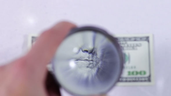 One Hundred Dollars Under The Magnifying Glass