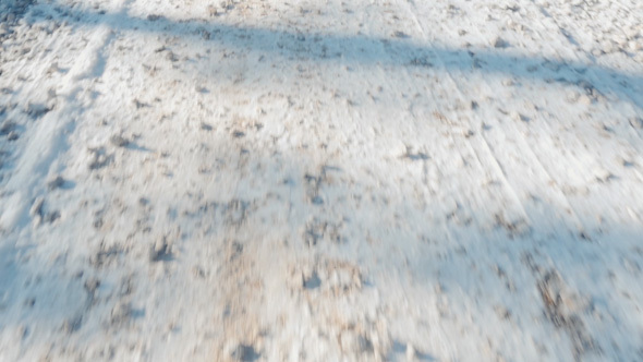 Walking on Snowy Gravel Road alt