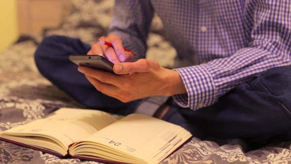 Man at Home Using a Telephone in Planning