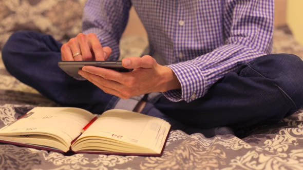 Man at Home Using a Telephone in Planning