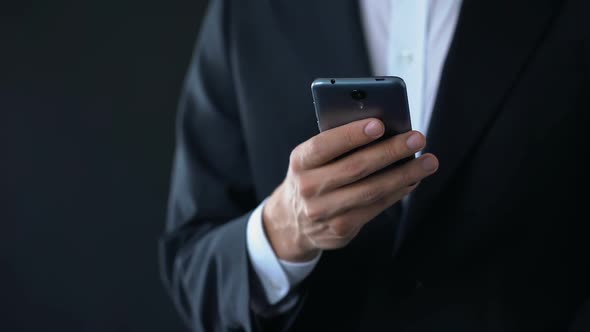 Businessman Checking Meeting Calendar Online, Texting Message on Smartphone