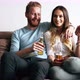Beautiful Couple in Love Watching Tv and Drinking - VideoHive Item for Sale