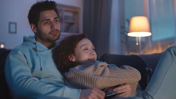 Man Running Hand Through Girlfriends Hair