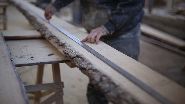 The Carpenter Draws a Line for Cutting Boards