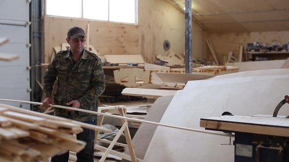 Carpenter Working with Circular Saw Woodworking Machine