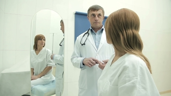 Upset Woman On a Medical Examination alt