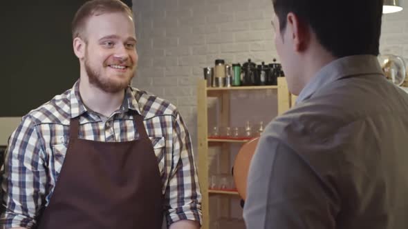 Barista Talking to Client