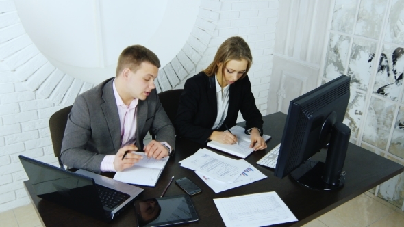 Colleagues At Work In The Office alt