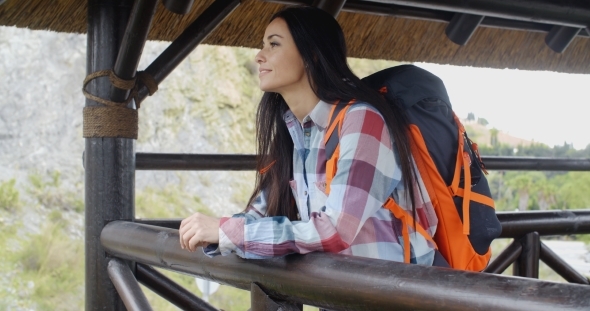 Smiling Backpacker On a Mountain Lookout