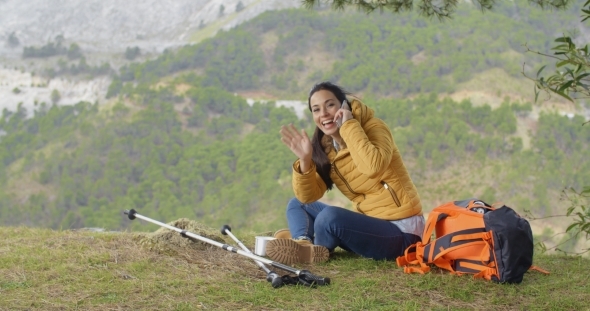 Happy Backpacker On Phone And Waving Hand