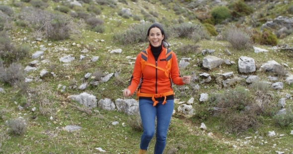 Vivacious Woman Enjoying a Mountain Hike