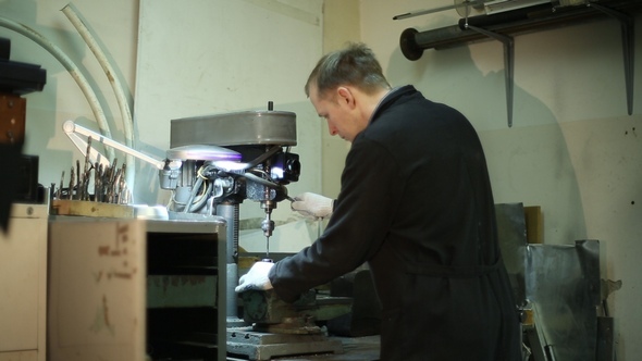 Scientist Working on a Drilling Machine