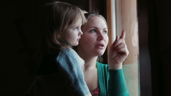 Mother Shows To The Daughter In a Window