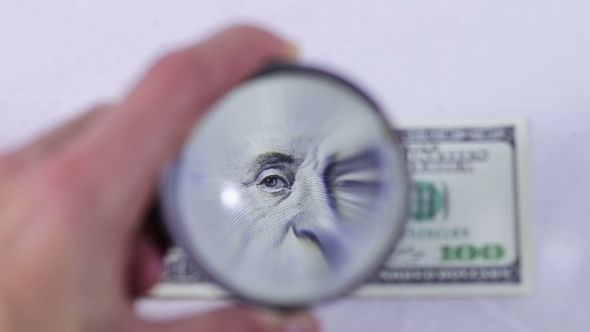 One Hundred Dollars Under The Magnifying Glass
