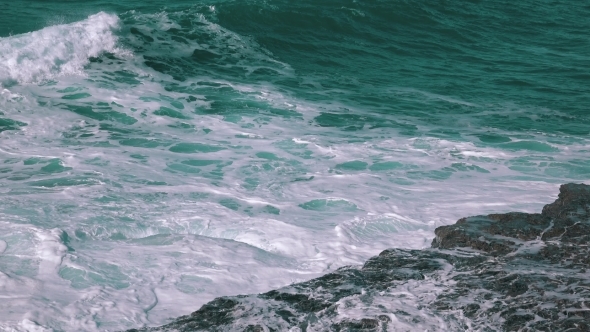 Ocean Waves Breaking On Rock