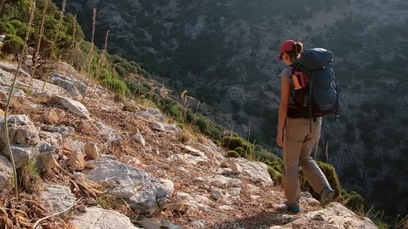Young Woman with Backpack Walk the Lycian Way Hiking Trail in Turkey.