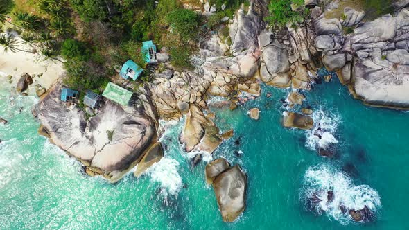 Wide above island view of a white sand paradise beach and aqua turquoise water background