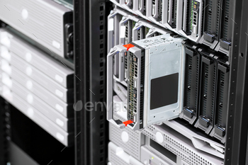  center. Racks with servers and backup drives.