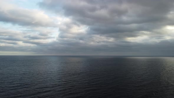 Aerial View From Above on Calm Azure Sea and Volcanic Rocky Shores