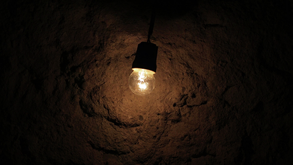 Bulb Flashing on a Background of Ancient Wall