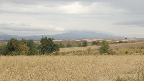 Slow tilt on Eastern Serbia landscape with cloudy sky 4K 2160p 30fps UltraHD footage - Famous Stol a