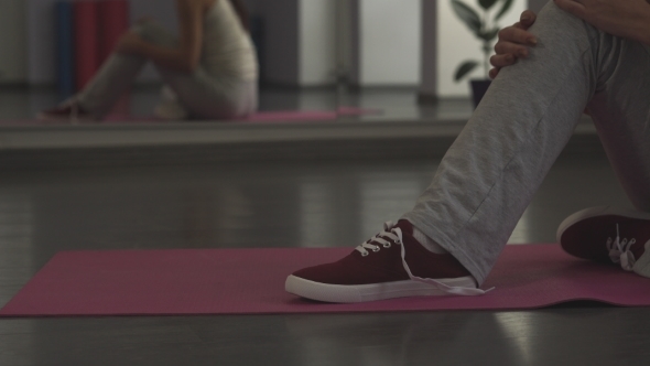 Girl Tying Shoelaces On Sneakers 