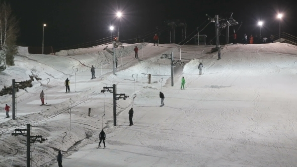 Skiers And Snowboarders On a Ski Lift