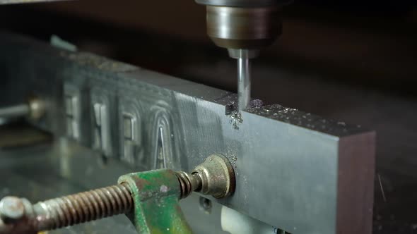 CNC Router working with an aluminum piece shaving slow motion