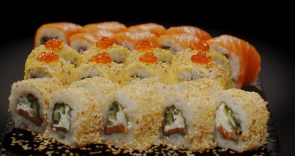 Large Selection Of Sushi Laid Out On A Platter. Japanese Cuisine