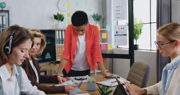 businesswoman which looking into camera during meeting in office